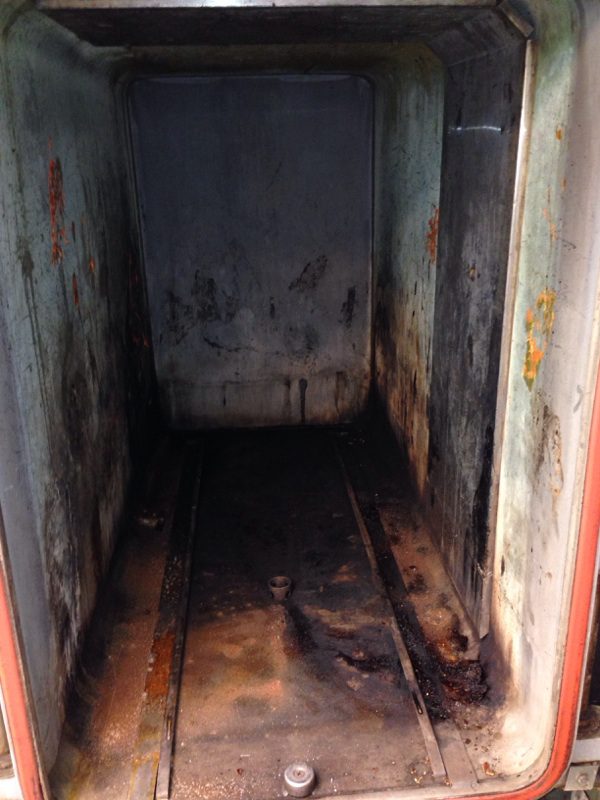 Old, rusty industrial oven interior
