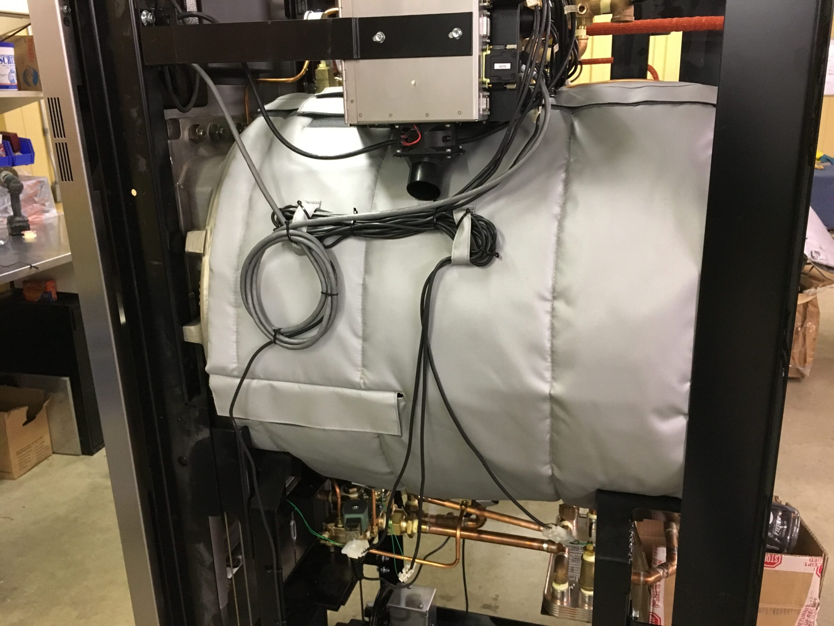 Industrial machine with wires and metal components.