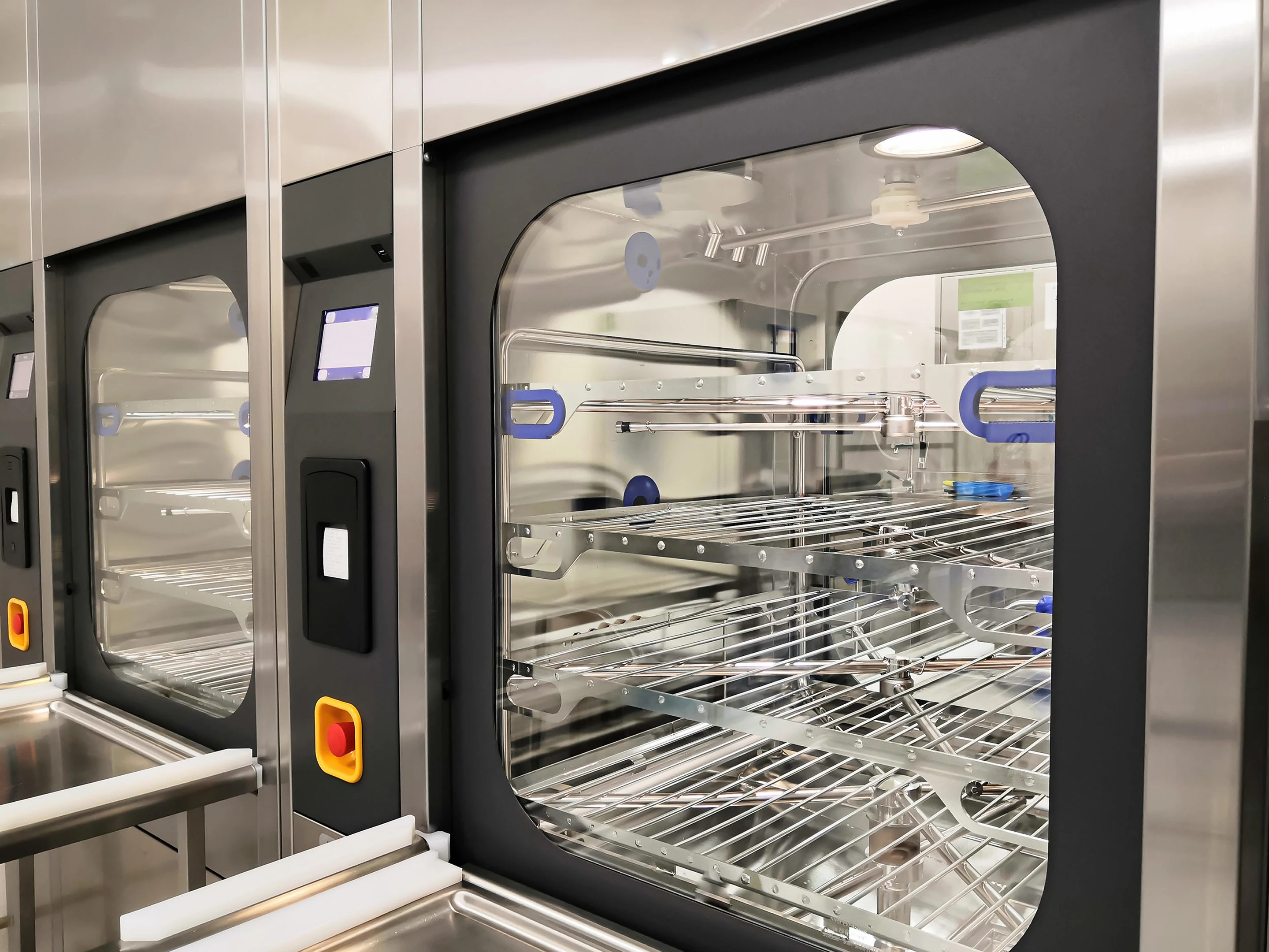 Sterilization equipment with transparent door and shelves.