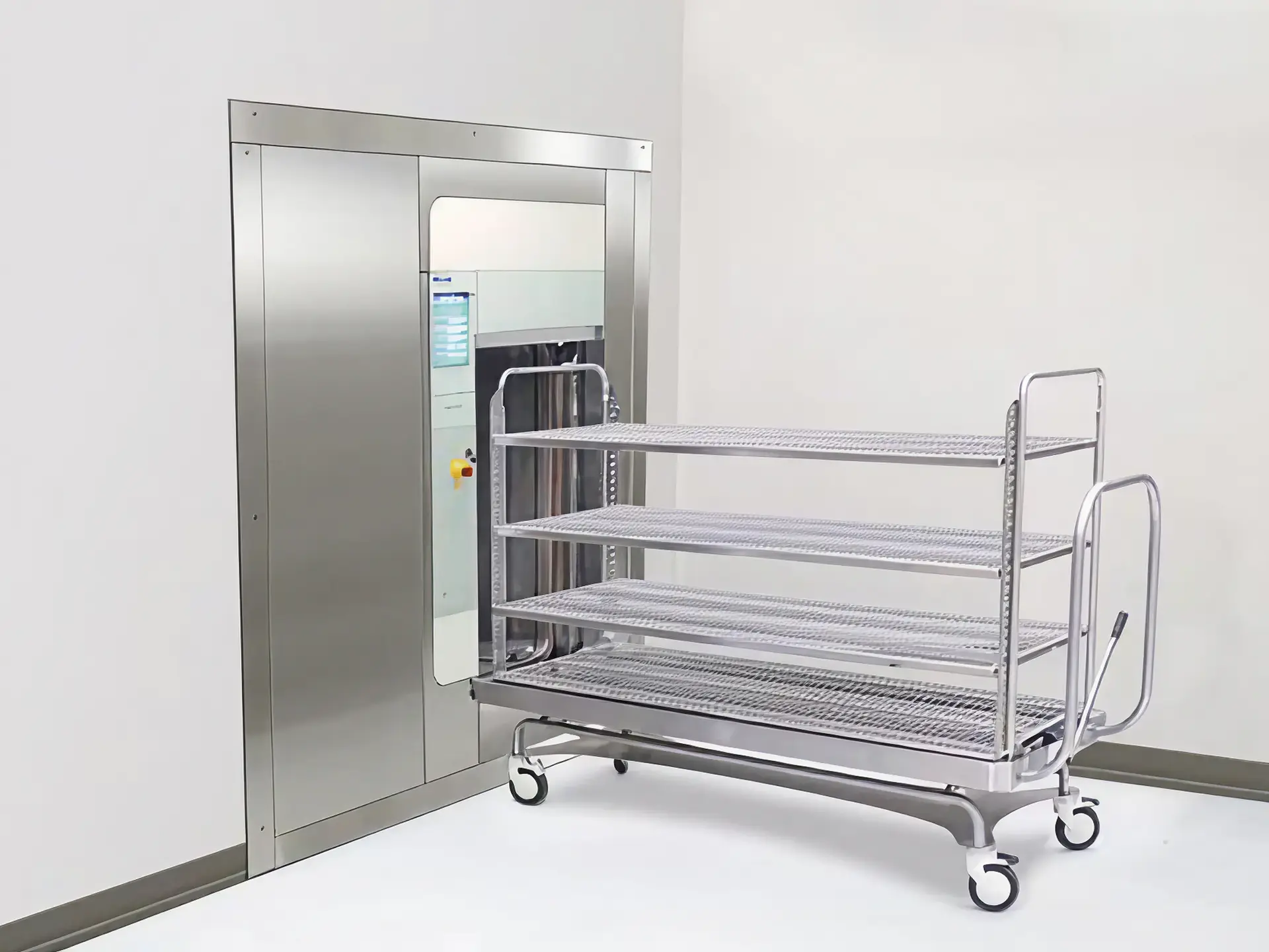 Medical sterilizer with stainless steel cart.
